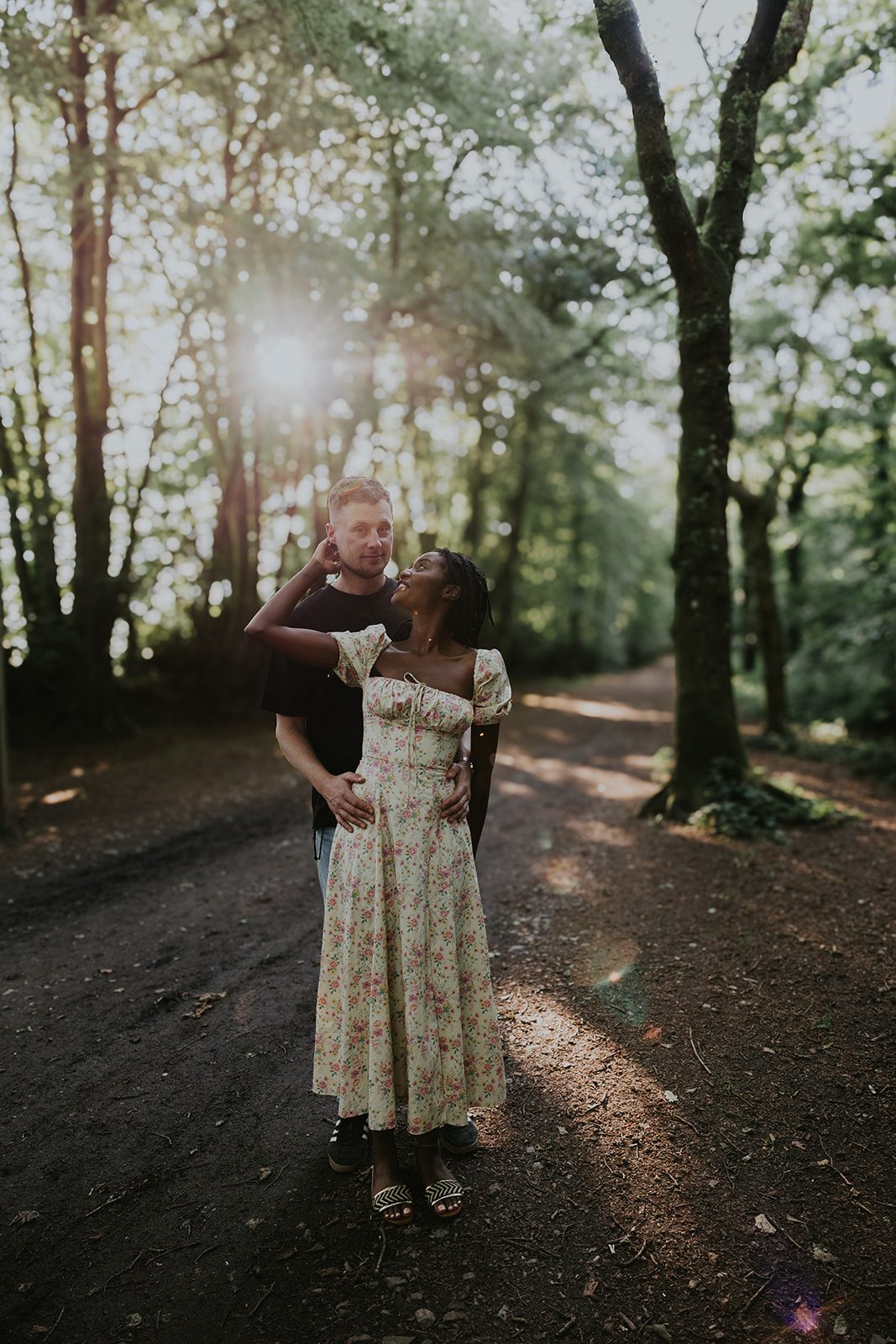 Loretta and Andy together on a sunlit woodland path