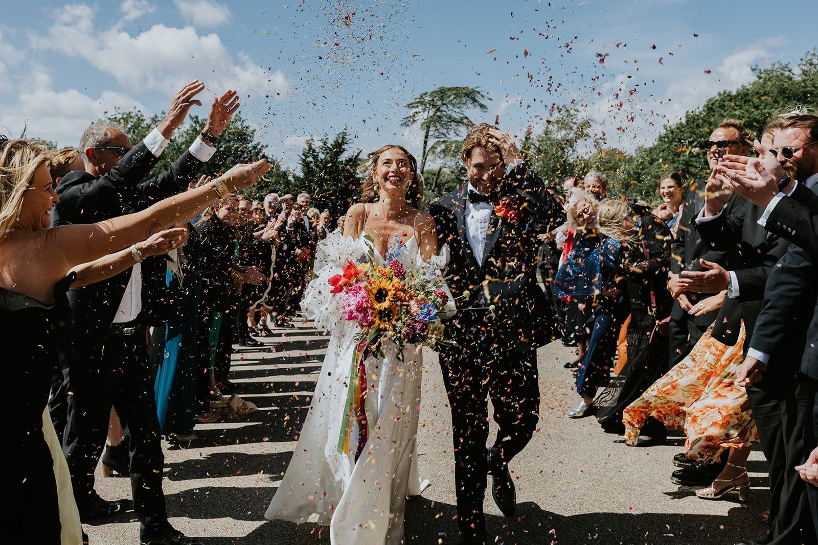 A joyful wedding confetti exit