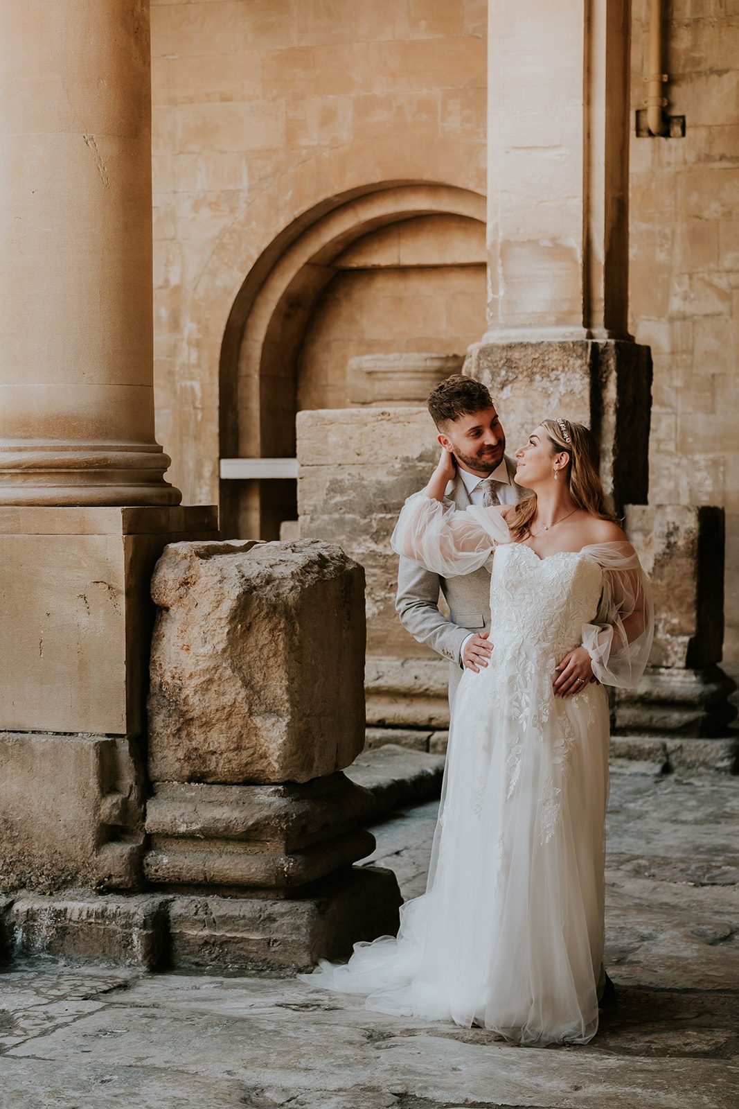 Isabelle and Dean together among the Roman Baths columns
