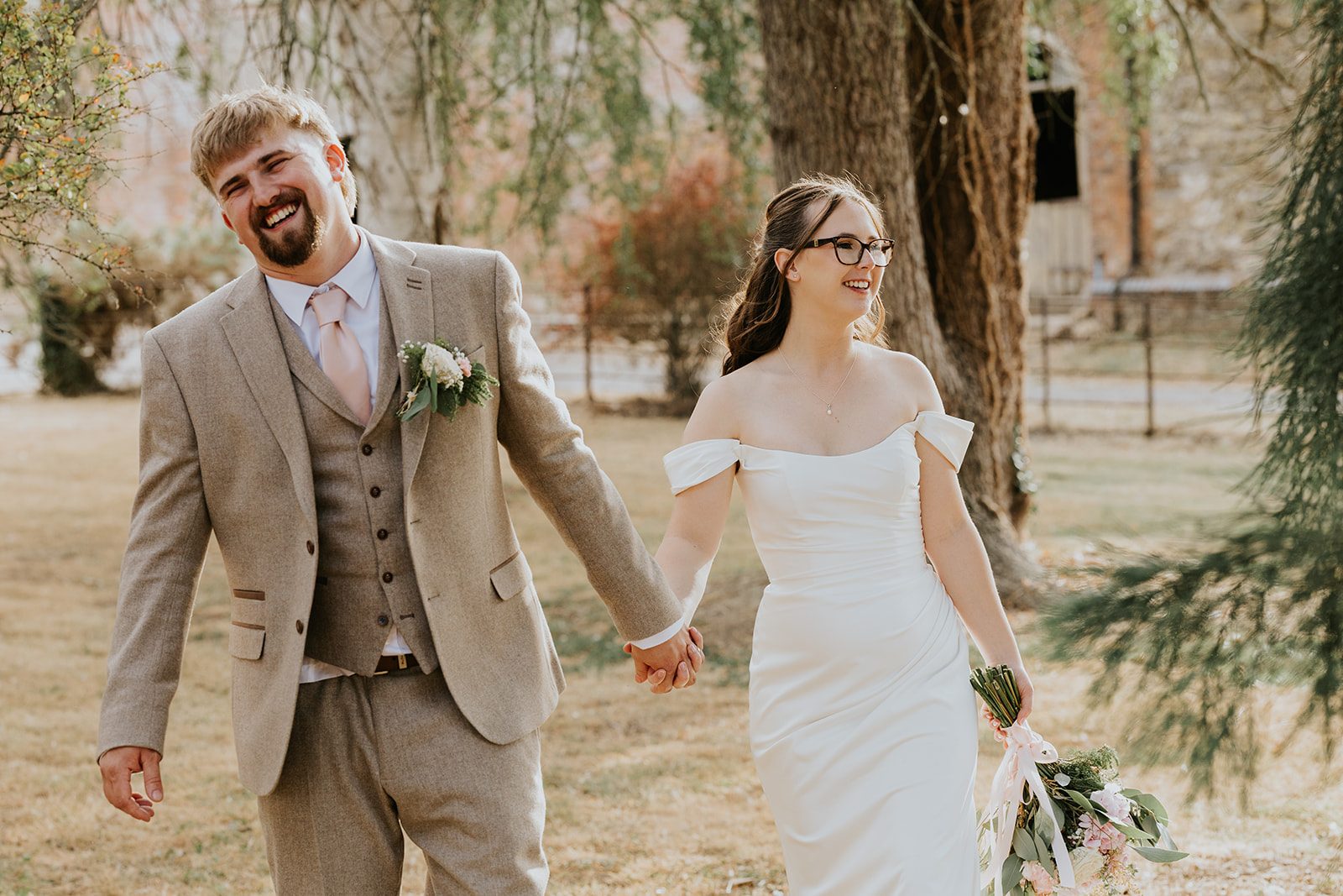Jess and Ollie laughing as they walk together
