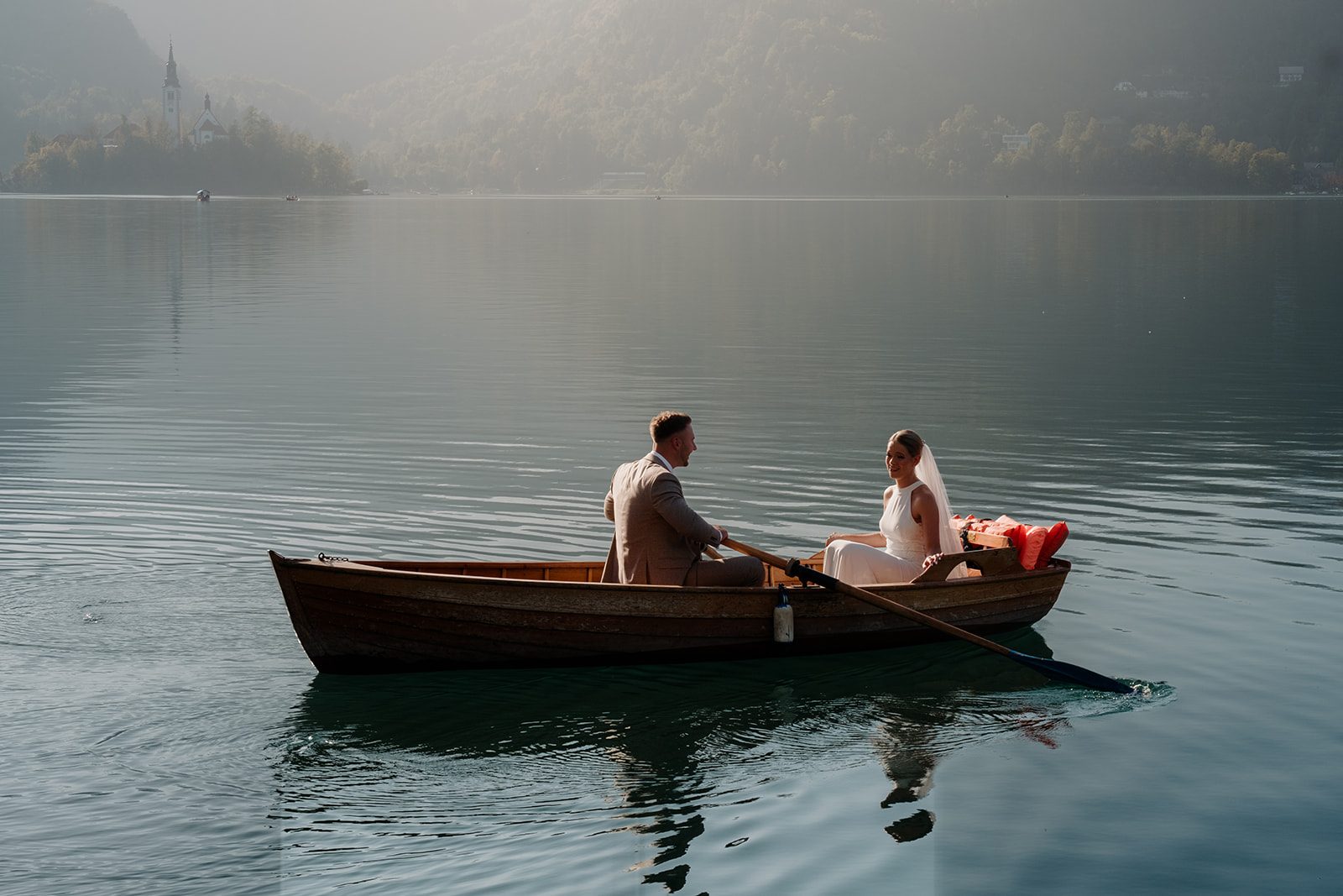 Zoe and Liam rowing together on Lake Bled in Slovenia